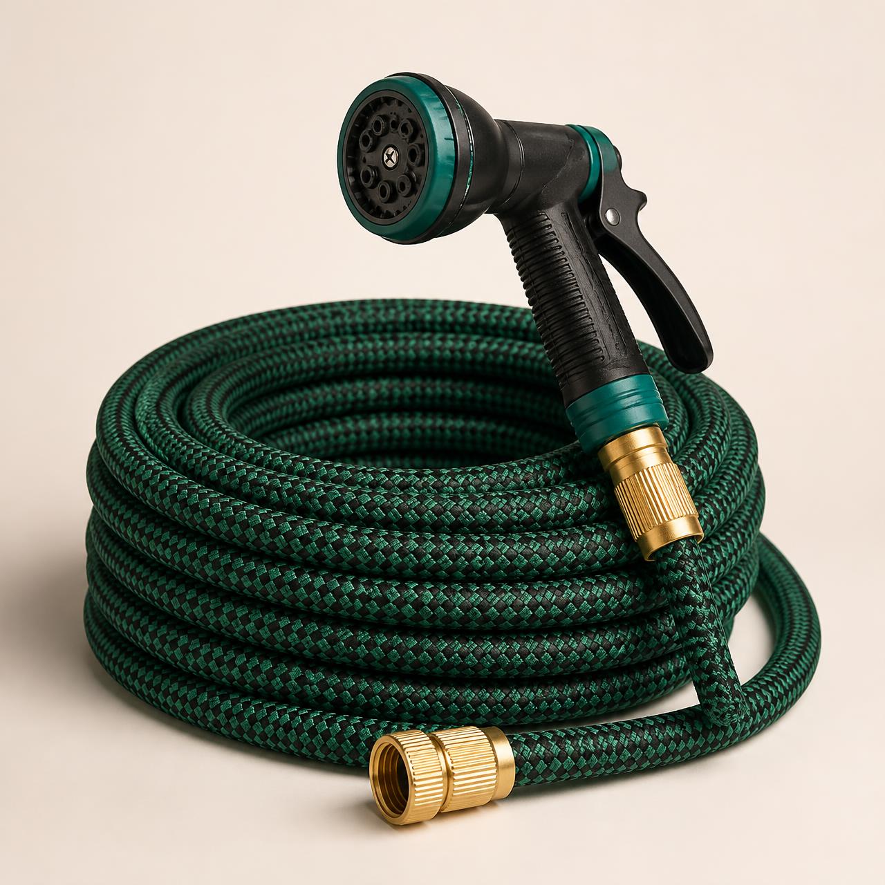 The GardenWorks Expandable Hose Kit coiled with brass fittings and spray nozzle